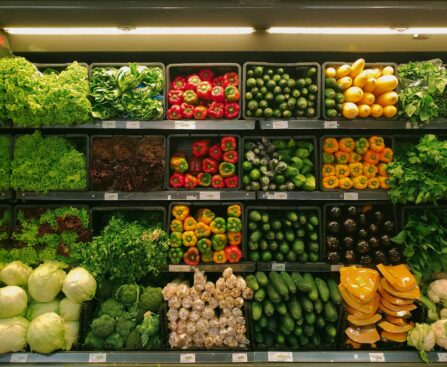 Rows of fresh produce and supermarket aisles illustrating a large-scale grocery store video challenge